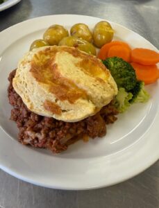 Bolognaise Cobbler with fresh vegetables from 1 Oak Community Meals CIC