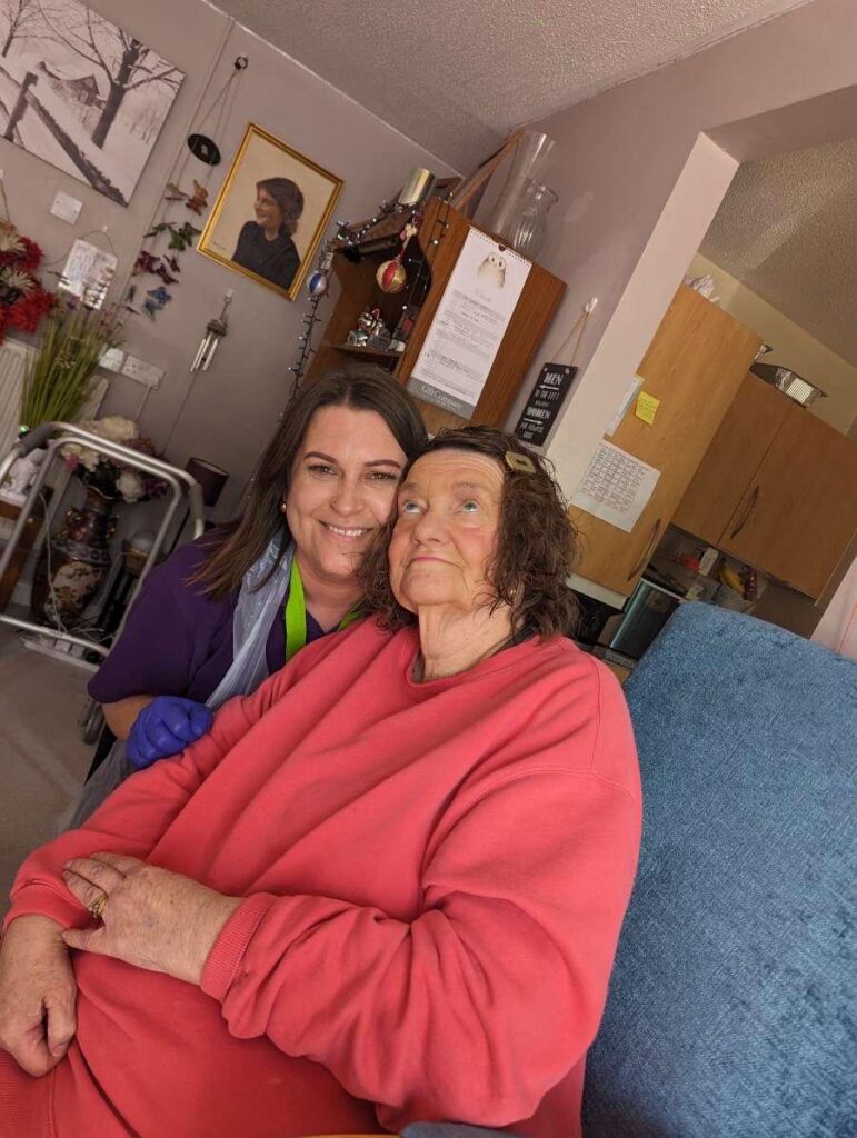 Fun times in a Sudbury Home Care client front room, happy carer and happy client