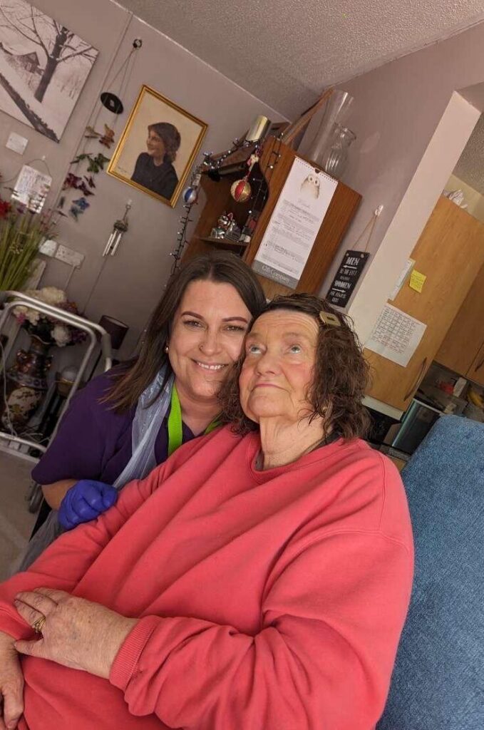 Fun times in a Sudbury Home Care client front room, happy carer and happy client