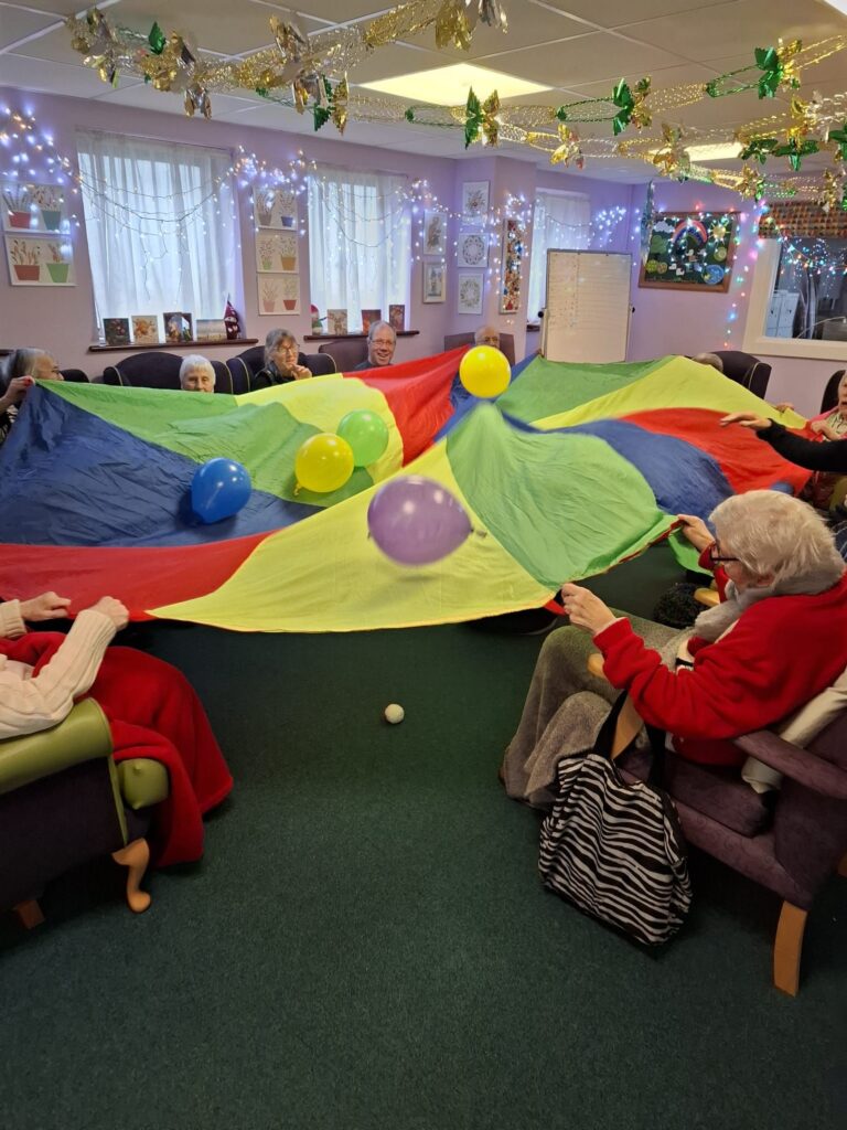 One of the rooms at the 1 Oak Chilton Club that has a group of our members playing with a large multicoloured sheet and bouncing balloons all over the place