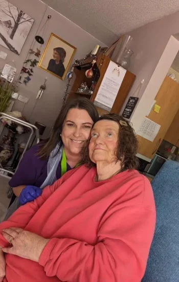 Fun times in a Sudbury Home Care client front room, happy carer and happy client